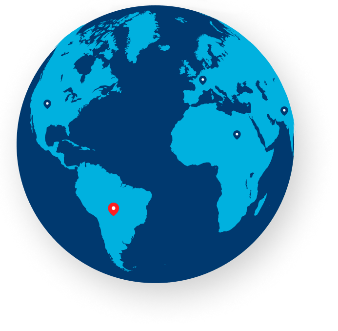 An image of a globe with a series of blue location pins on it. A red pin is on South America