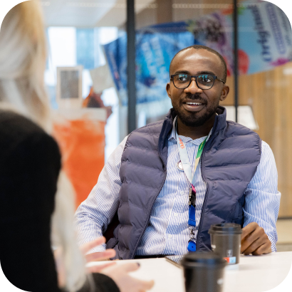 A man sitting at a table in an office
