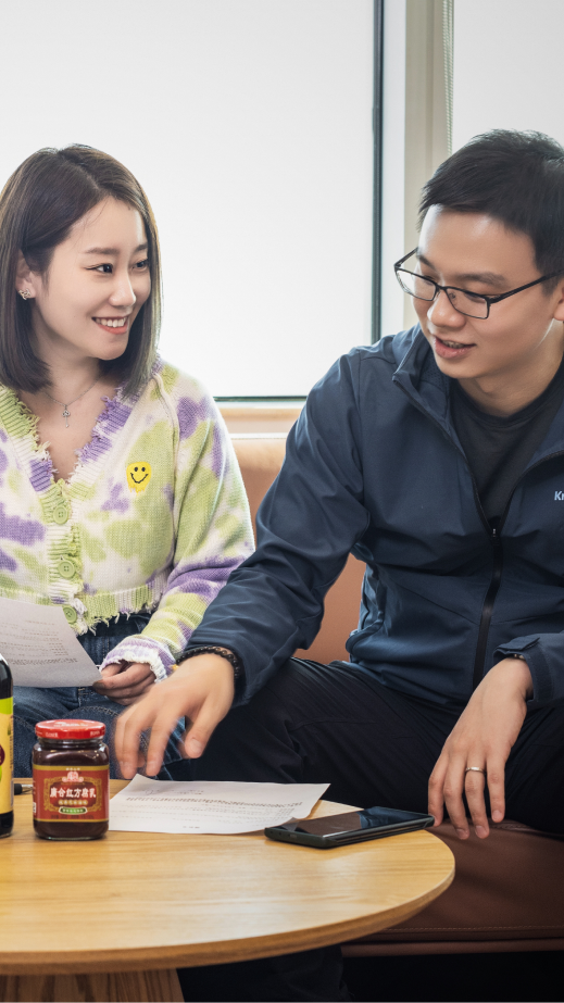 Japan1 A man and a woman in conversation together in an office.